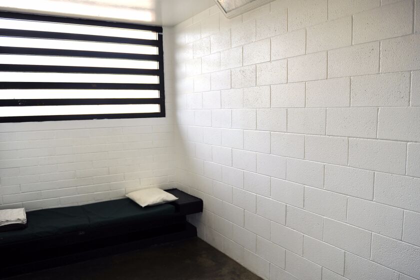 An empty solitary confinement cell at the Barry J. Nidorf Jevenile Hall in Sylmar.