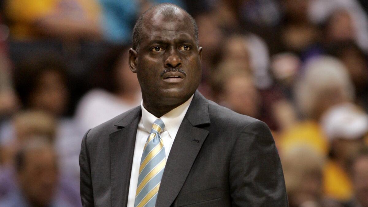 Former Lakers standout and ex-Sparks coach Michael Cooper looks on during a game between the Sparks and Sacramento Monarchs in 2009.