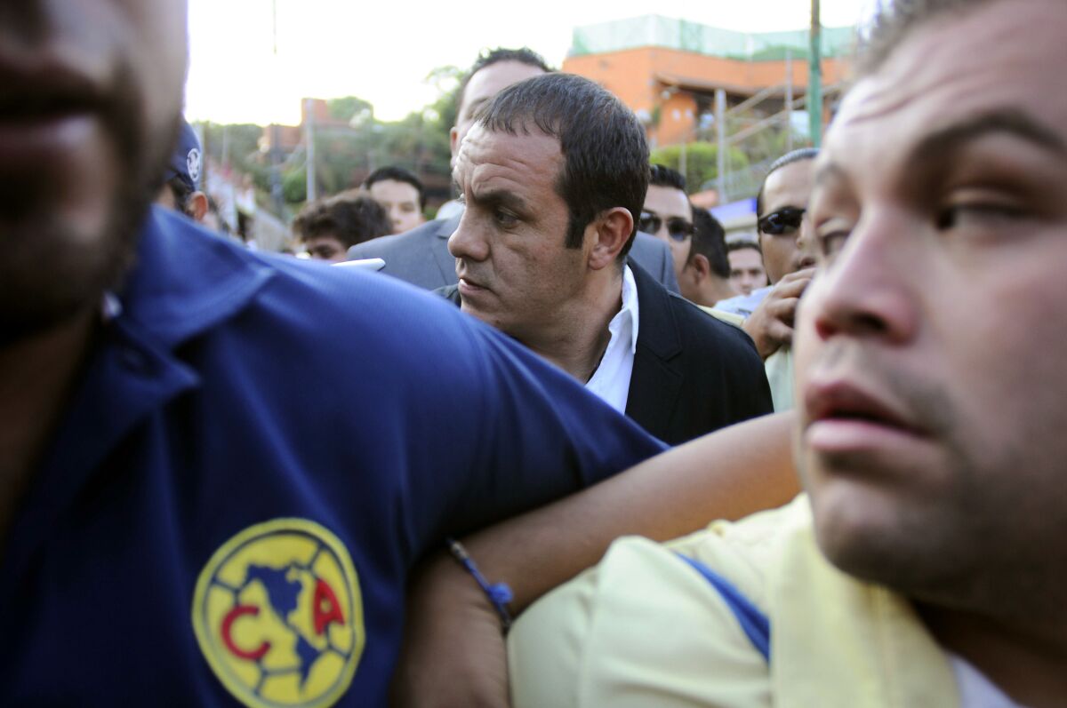 Former Mexican soccer star Cuauhtemoc Blanco, center, arrives to a government office 
