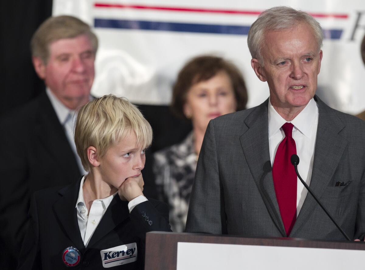Watched by his son Henry, Democratic Senate candidate Bob Kerrey delivers his concession speech at the Nebraska Democratic Party's election night gathering in La Vista.