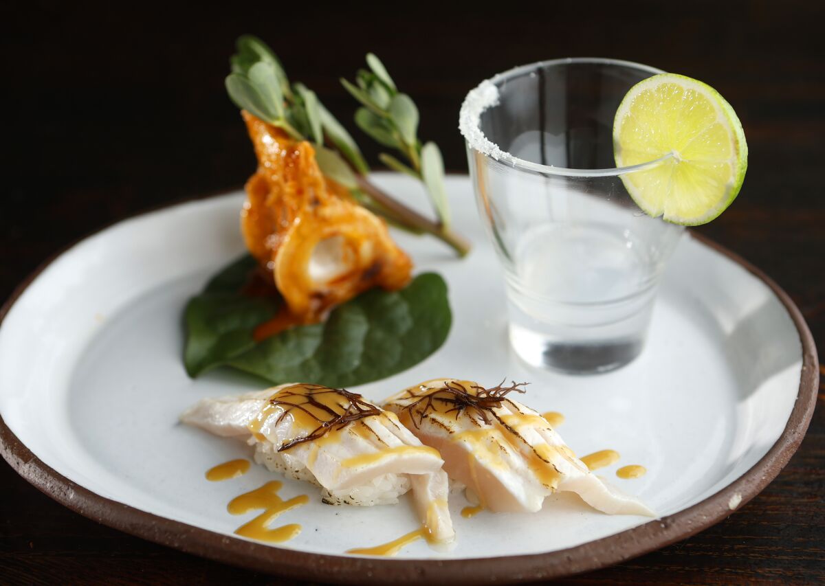 Swordfish nigiri with swordfish bone marrow shot and fried vertebra at Wrench & Rodent Seabasstropub in Oceanside.