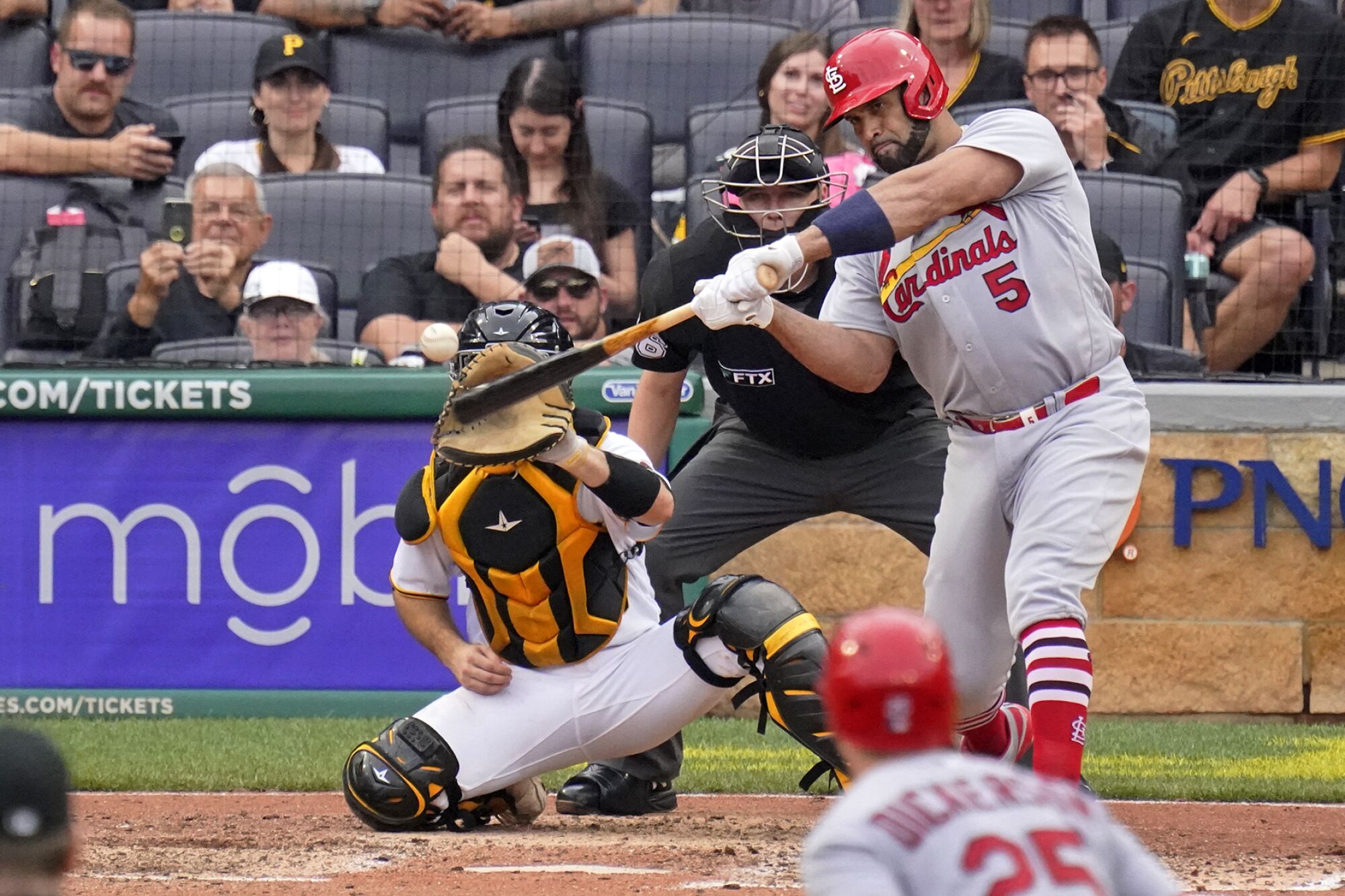 St. Louis Cardinals slugger Albert Pujols hits a two-run home run off Pittsburgh Pirates relief pitcher Chase De Jong.