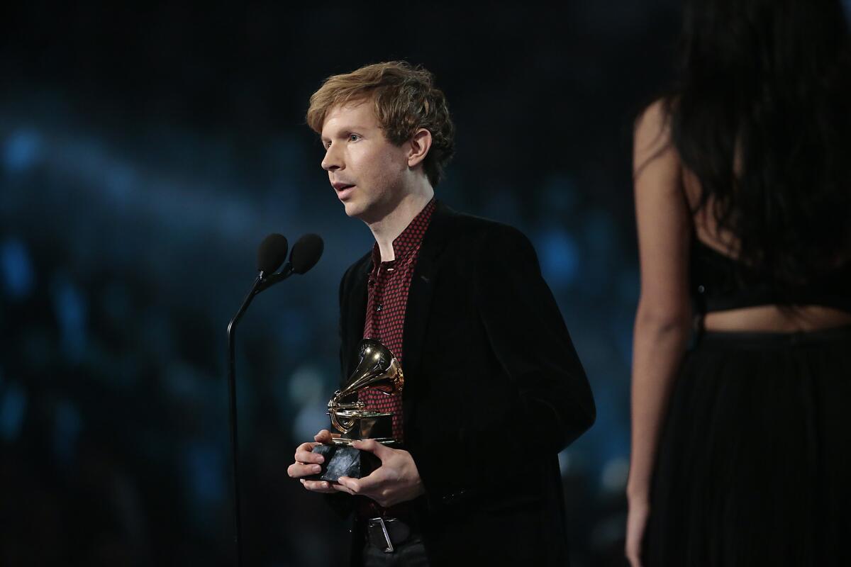 Beck accepts the Album of the Year Grammy for "Morning Phase" during The 57th Annual Grammy Awards.