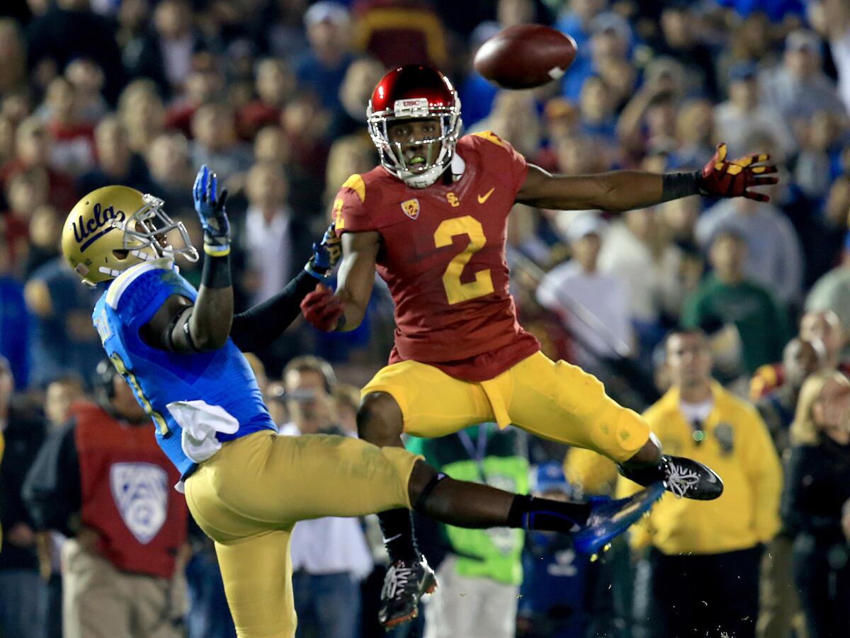 USC cornerback Adoree' Jackson breaks up a pass intended for UCLA receiver Devin Fuller during the rivalry game last season.