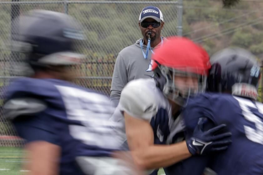 SAN DIEGO, CA - MAY 02, 2024: USD head football coach Brandon Moore watches his players during practice at USD in San Diego on Thursday, May 02, 2024.
