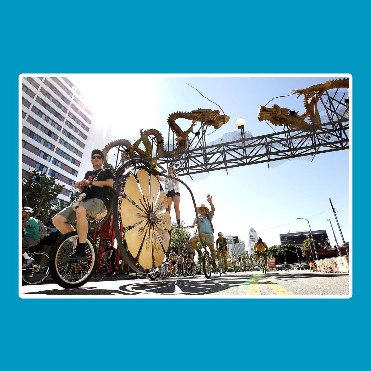 Two men riding an ornate tandem bicycle