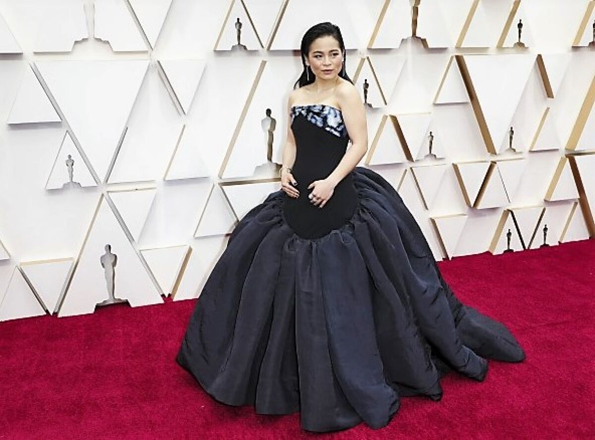 San Diego native Kelly Marie Tran on the red carpet at the 92nd Academy Awards on Feb. 9, 2020 is wearing an elegant dress by Schiparelli.