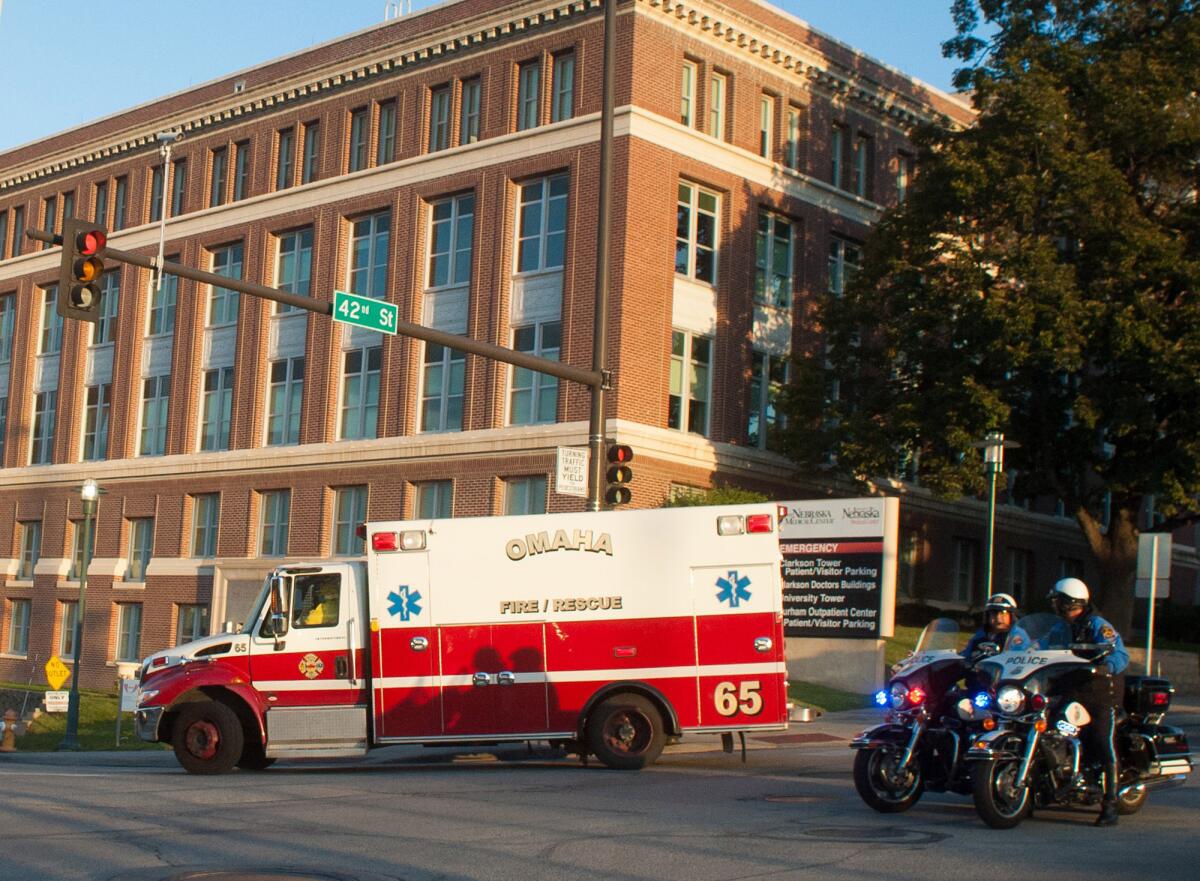 An ambulance transports Ashoka Mukpo, who contracted Ebola while working in Liberia, to the Nebraska Medical Center's specialized isolation in October. Mukpo was successfully treated for the disease.