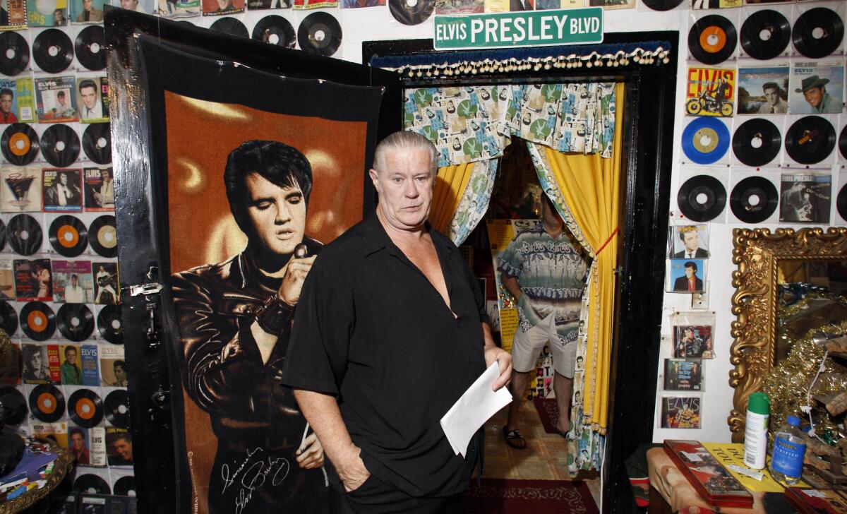 Elvis Presley fan Paul MacLeod gives a tour of his collection of Presley-related items at his home in Holly Springs, Miss., in 2007.