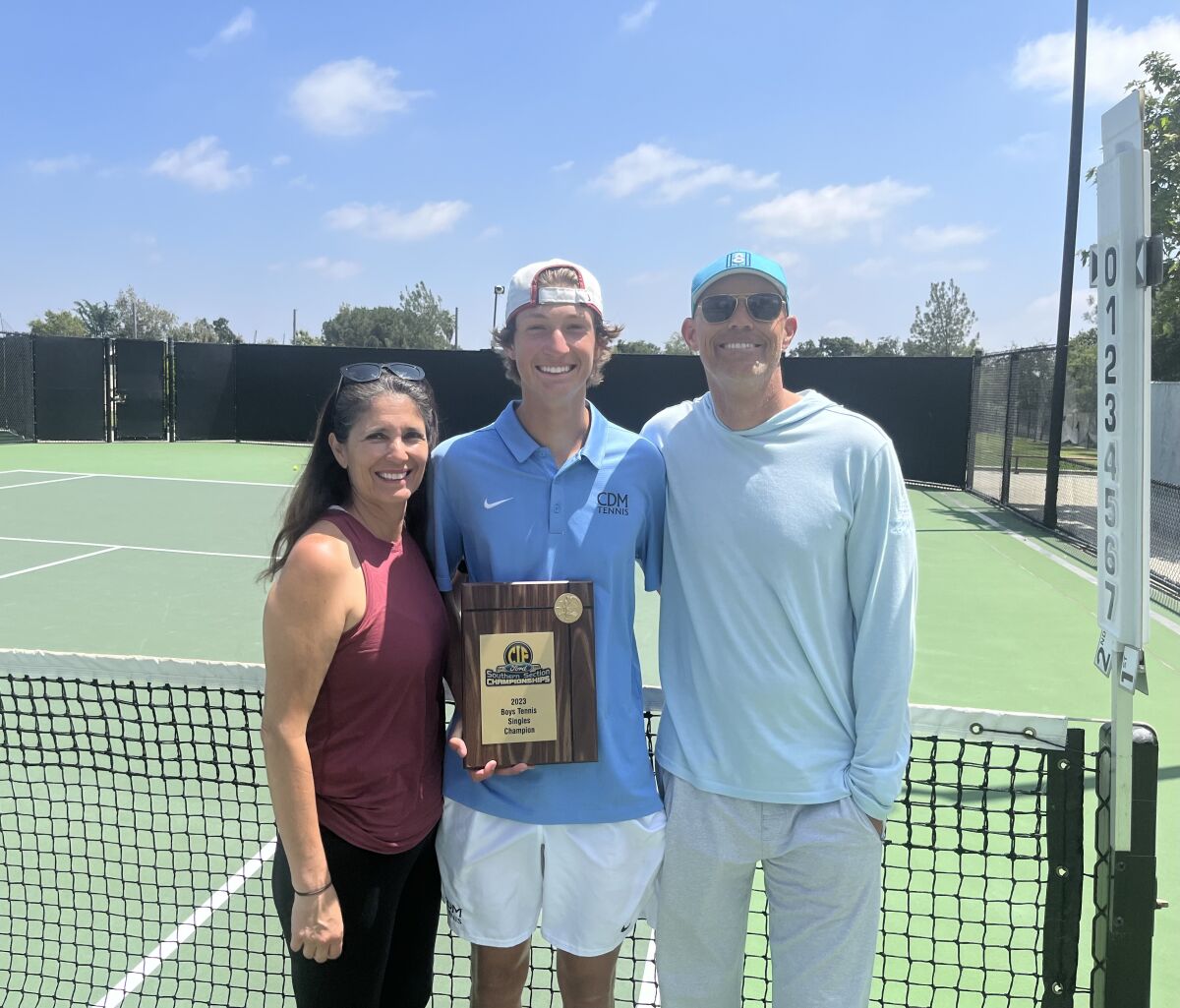 CdM boys' tennis junior Niels Hoffmann pictured with his parents Biljana Longman, left, and Carsten Hoffmann.