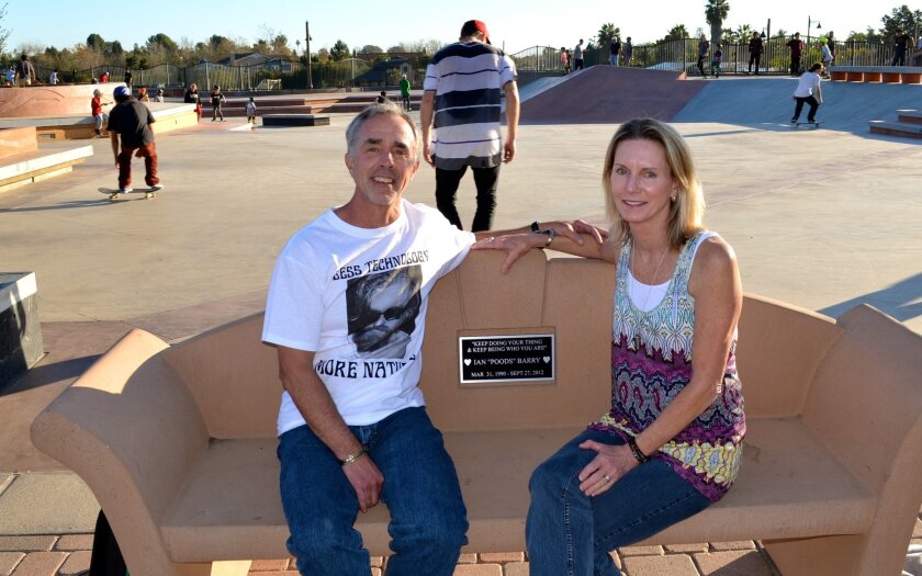 John and Alison Barry sit on a bench at the Encinitas Skate Plaza dedicated to their son Ian ‘Poods’ Barry, who passed away in 2012. Ian was known for his big heart, leading his parents to start a skateboarding nonprofit that aids underserved youth.