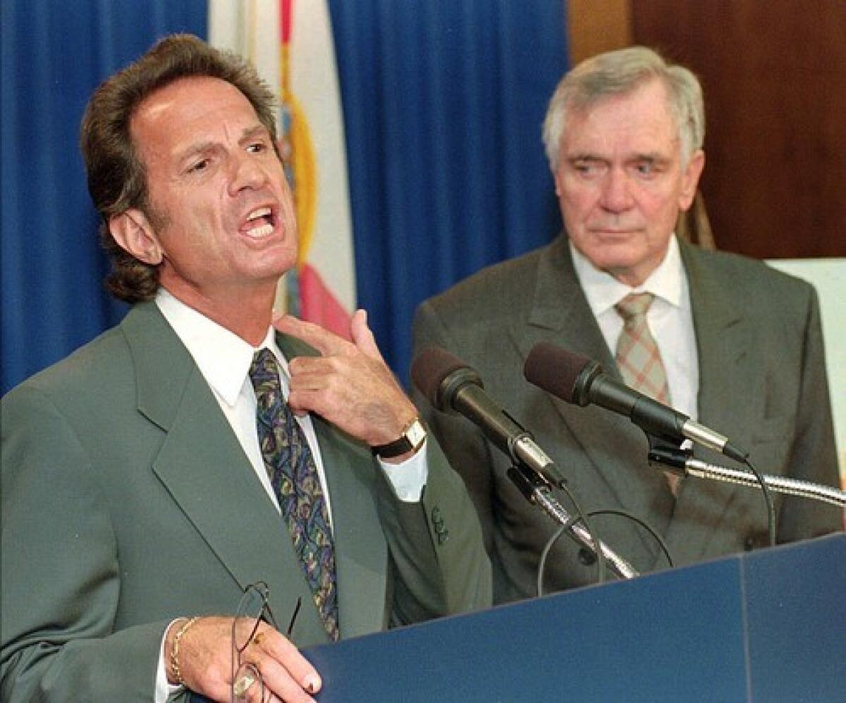 Alan Landers, left, joined Florida Gov. Lawton Chiles at a news conference in 1996 to fight tobacco use.