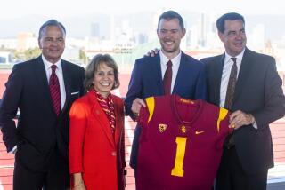 LOS ANGELES, CA - November 29 2021: From left Rick Caruso, USC President Carol L. Folt, new USC head football coach.