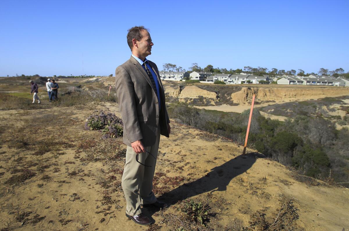 Coastal Commission commissioner and Executive Director Charles Lester takes a tour with coastal commissioners, staff, developers and general public during a field trip tour at the proposed development project at Banning Ranch near Newport Beach on June 11, 2014.