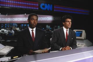 Fred Hickman and Nick Charles on the set of CNN's "Sports Tonight" in 1980.