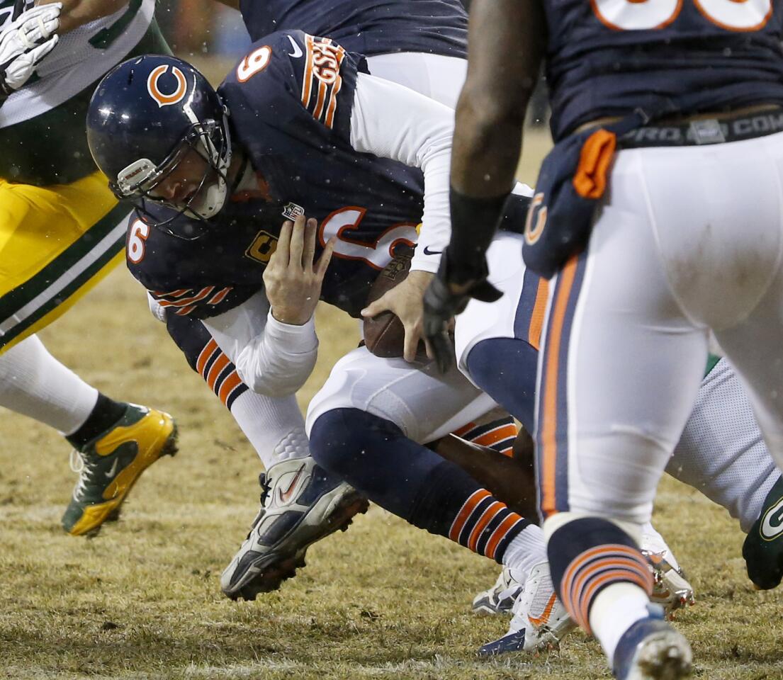 Jay Cutler is sacked by the Green Bay Packers defense in the second quarter at Soldier Field.