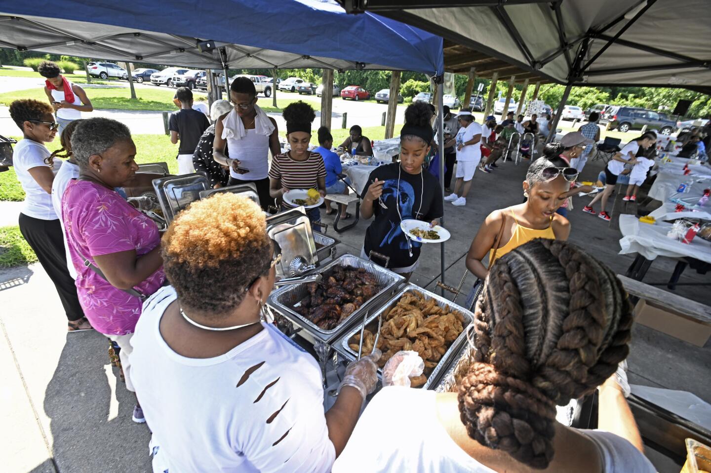 Friends and families of Daphne Alston gather for the 10th annual Tariq's Memorial Cookout at Turner Station Park to remember him. Tariq Alston, 22, was killed July 14, 2008 in Joppa and the case remains unsolved.