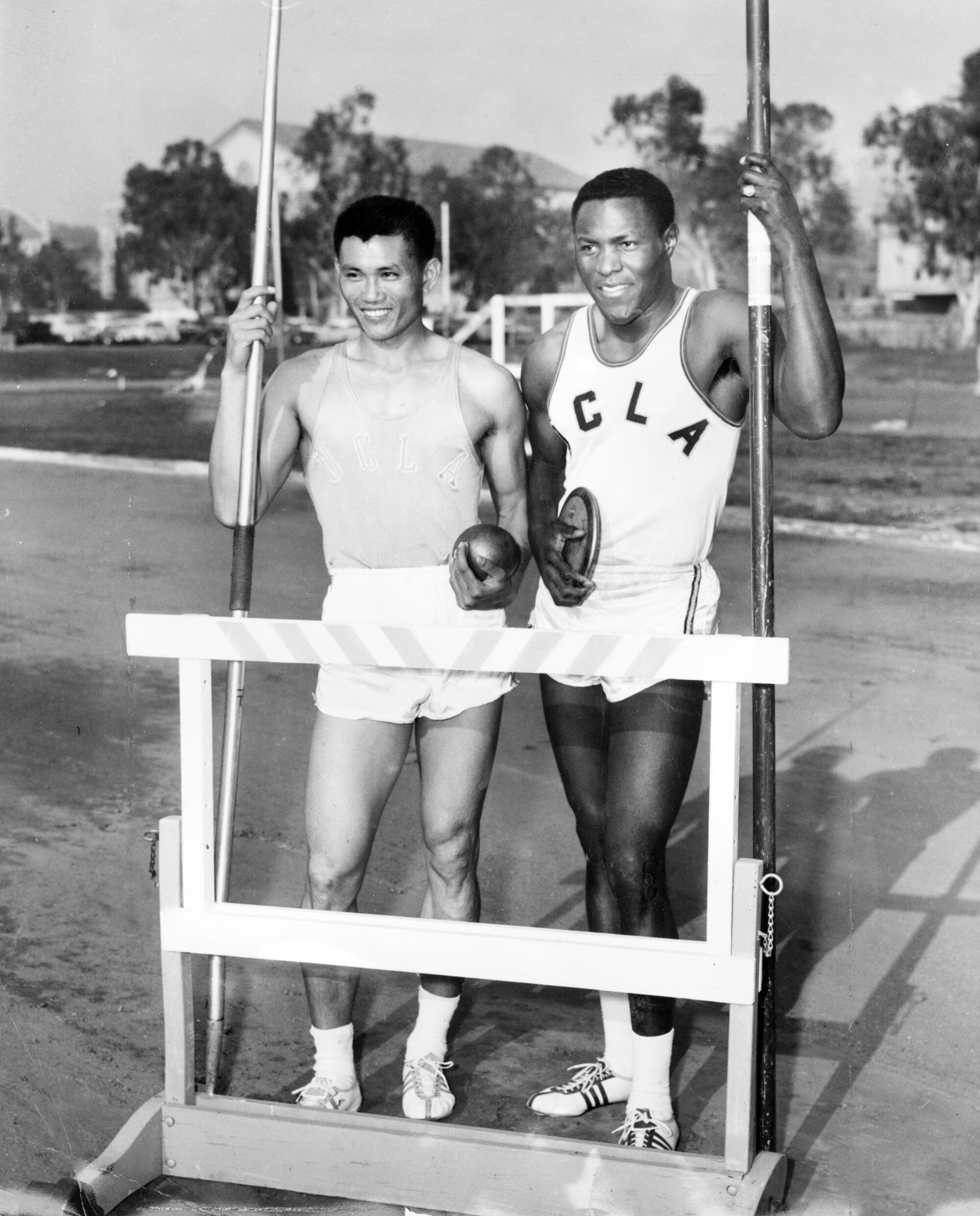 Rafer Johnson, right, with UCLA freshman C.K. Kang at track practice in 1960.