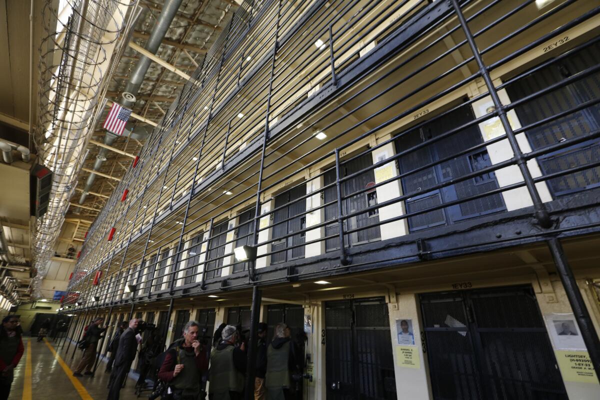 Media members tour death row in the East Block at San Quentin prison in December 2015. 