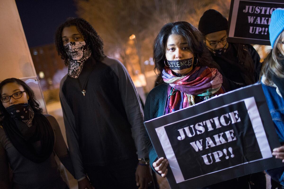 Ferguson activists march through downtown during a protest in St. Louis, Mo.