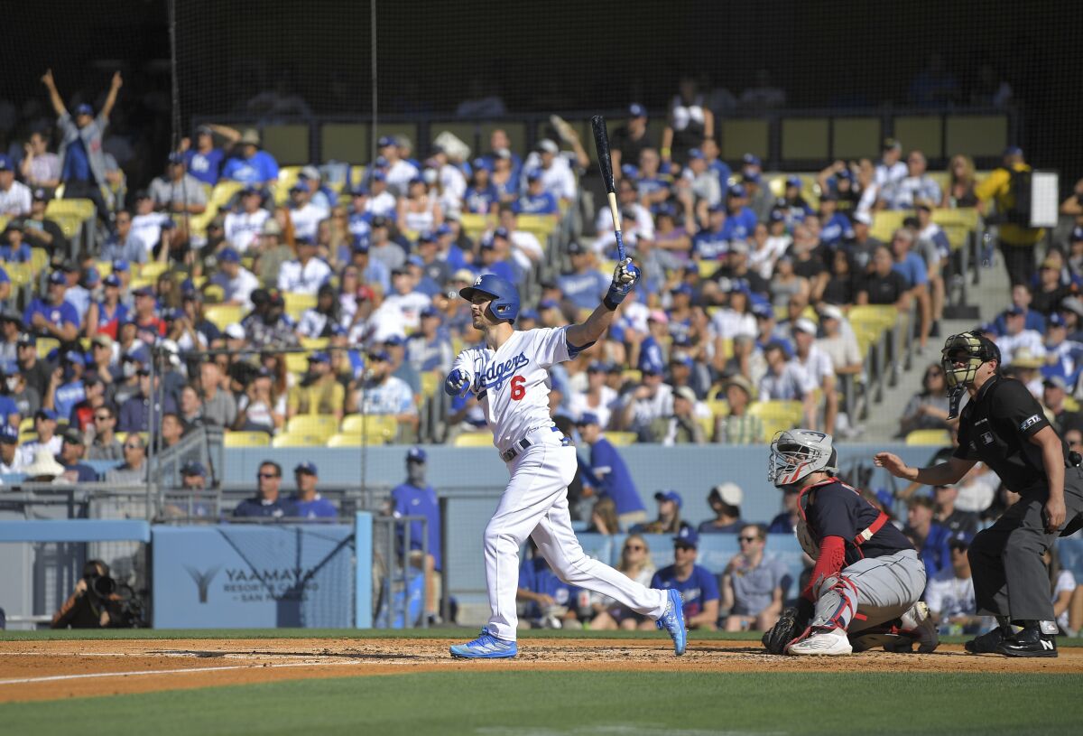 The Dodgers' Trea Turner watches his two-run home run during the second inning June 18, 2022.