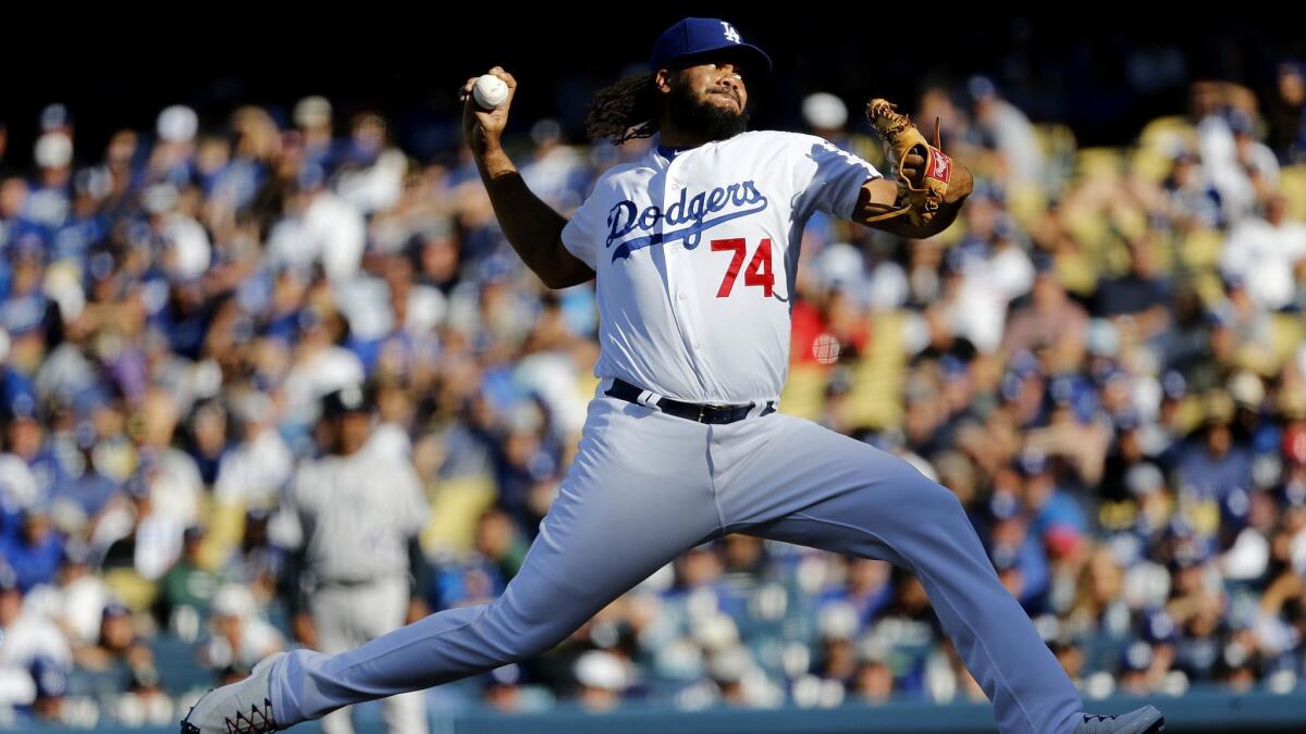 Dodgers relief pitcher Kenley Jansen delivers a pitch in the ninth inning against the Colorado Rockies in a National League West tiebreaker game played at Dodger Stadium.