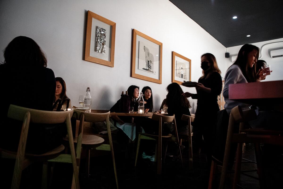 Inside the bustling dining room at Kinn, a new restaurant from chef Ki Kim in Koreatown.
