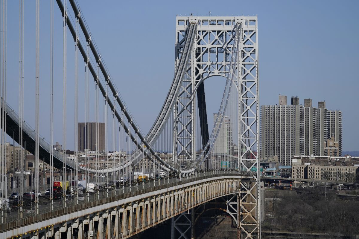 In this April 6, 2021, file photo traffic moves over the George Washington Bridge as seen from Fort Lee, N.J.  