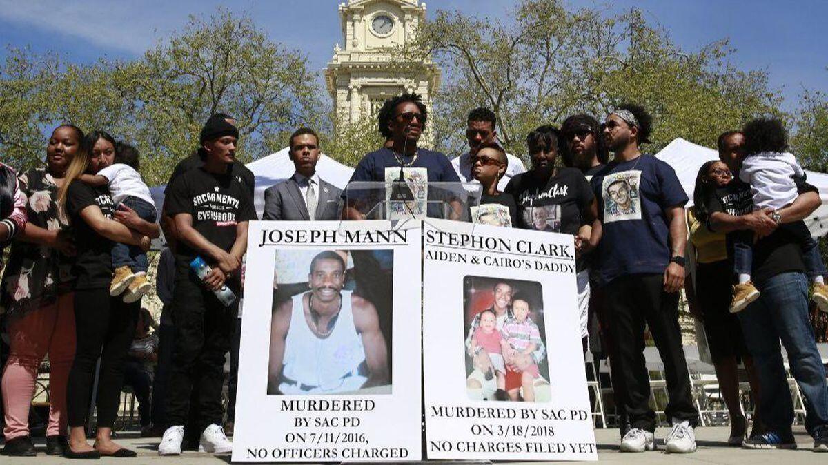Curtis Gordon, center, the uncle of Stephon Clark, speaks at a rally in Sacramento on Saturday calling for police reforms.