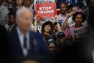 Supporters hold up signs as President Joe Biden speaks at a campaign rally in Raleigh, N.C., Friday, June. 28, 2024. (AP Photo/Matt Kelley)