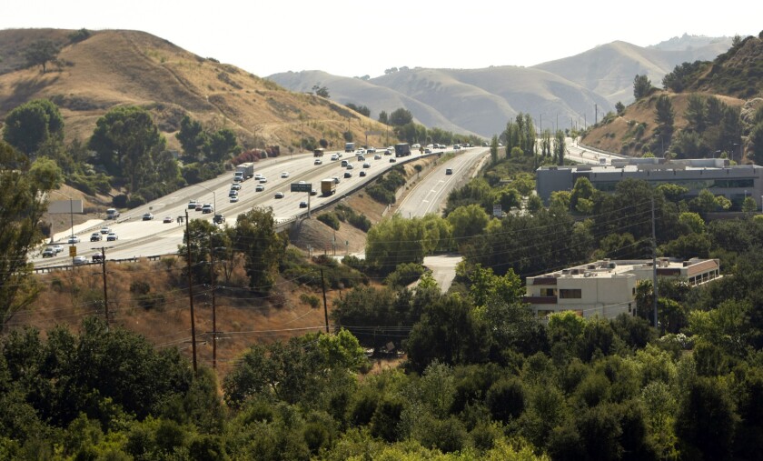 Urban wildlife specialists recommend building a tunnel under the 101 Freeway to provide safe passage for mountain lions, bobcats and other animals. Above, the 101 at Liberty Canyon.