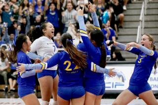 El Camino Real players celebrate the final point of their four-set victory over Taft.