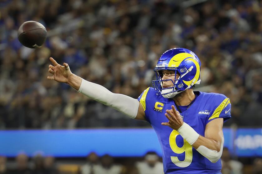 Rams quarterback Matthew Stafford throws a pass against the Saints.