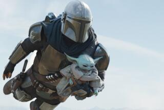 A man in a Mandalorian costume and helmet flying through the air while carrying Grogu, a.k.a. Baby Yoda