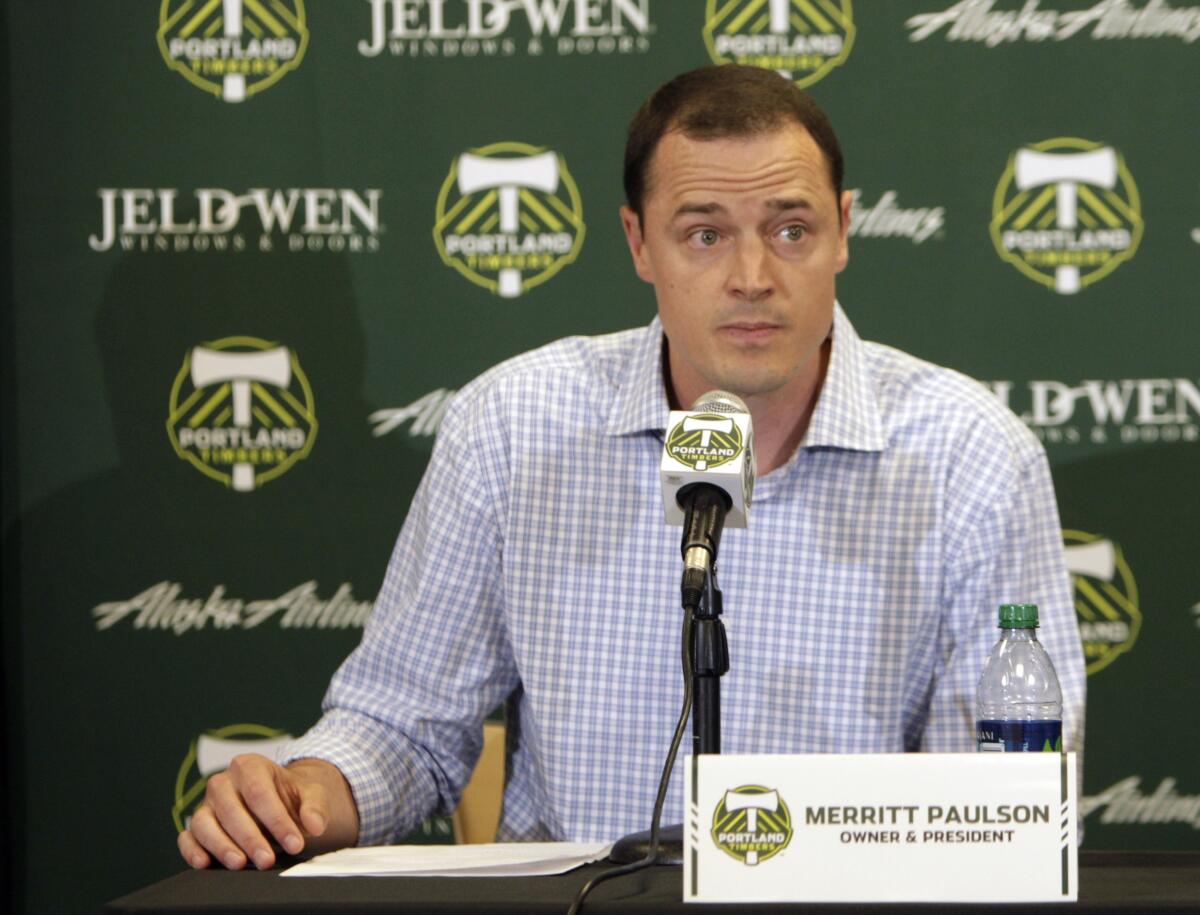 FILE - Portland Timbers president Merritt Paulson speaks during a soccer news conference announcing the firing of Timbers coach John Spencer on July 9, 2012, in Portland, Ore. Paulson, who also owns the Portland Thorns women soccer team, has removed himself from a decision-making role with the National Women’s Soccer League club until the findings are released from an ongoing investigation into numerous scandals around the league. (AP Photo/The Oregonian via AP, File)