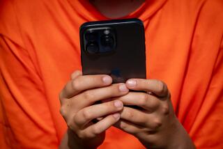 PENZANCE, UNITED KINGDOM - AUGUST 15: A 12-year-old boy looks at a iPhone screen on August 15, 2024 in Penzance, England. The amount of time children spend on screens each day rocketed during the Covid pandemic by more than 50 per cent, the equivalent of an extra hour and twenty minutes. Researchers say that unmoderated screen time can have long-lasting effects on a child's mental and physical health. Recently TikTok announced that every account belonging to a user below age 18 have a 60-minute daily screen time limit automatically set. (Photo by Matt Cardy/Getty Images)