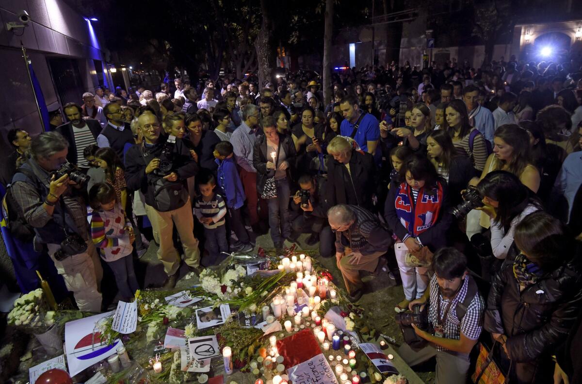 People gather outside the French Embassy in Mexico City on Nov. 16, 2015, in solidarity with the victims of the attacks in Paris.