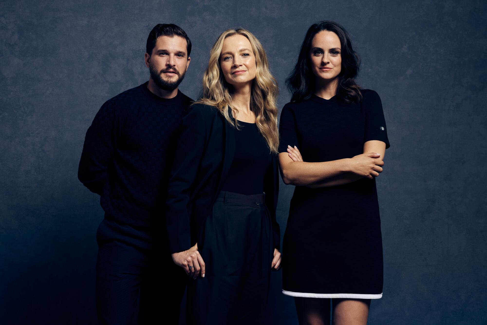 Kit Harington, director Bess Wohl and Noemie Merlant stand in dark clothes.