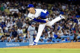 LOS ANGELES, CA - MAY 7, 2024: Los Angeles Dodgers pitcher Yoshinobu Yamamoto (18) reacts while pitching against the Miami Marlins in the fourth inning at Dodger Stadium on May 7, 2024 in Los Angeles, California.(Gina Ferazzi / Los Angeles Times)