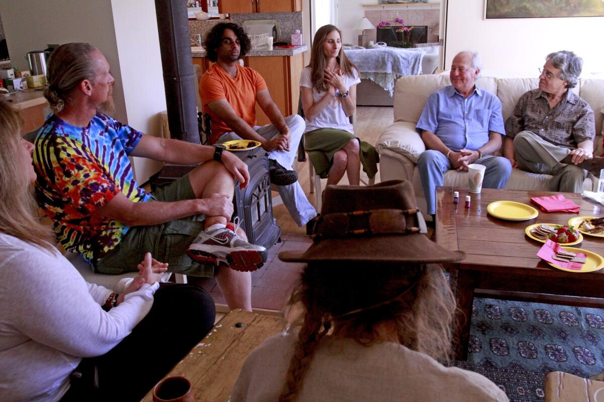 Betsy Trapasso, third from right, who describes herself as an end-of-life guide, holds the first Death Cafe in L.A. at her home in Topanga Canyon.