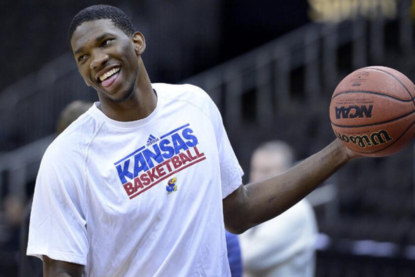 Kansas center Joel Embiid is expected to be one of the top picks of the 2014 NBA draft, but a foot injury could drop him into the Lakers' range at seven.