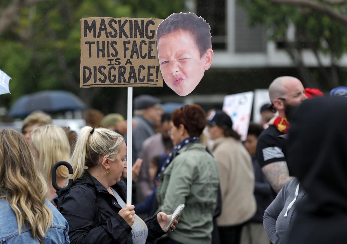 Costa Mesa mom Maren Chen at a "Let the Kids Breathe" rally at the county education office building in Costa Mesa Monday.