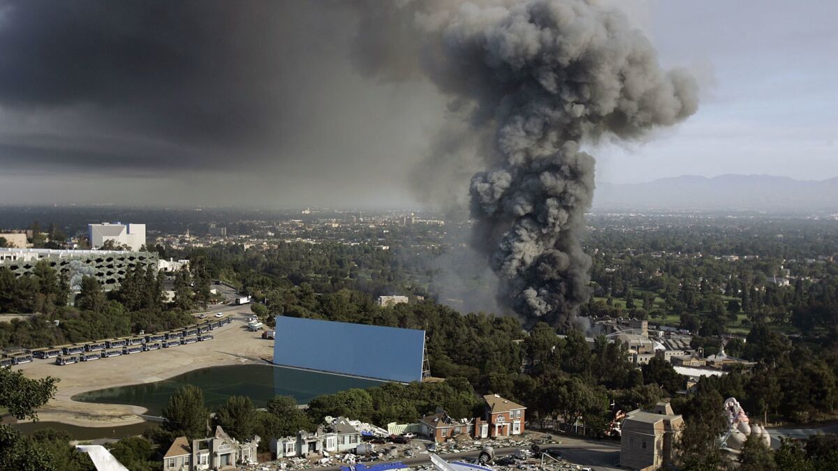 A June 1, 2008, file photo shows fire on the backlot at Universal Studios Hollywood. The blaze destroyed a storage facility that housed original master recordings made by some of the most important names in popular music, according to a new report.