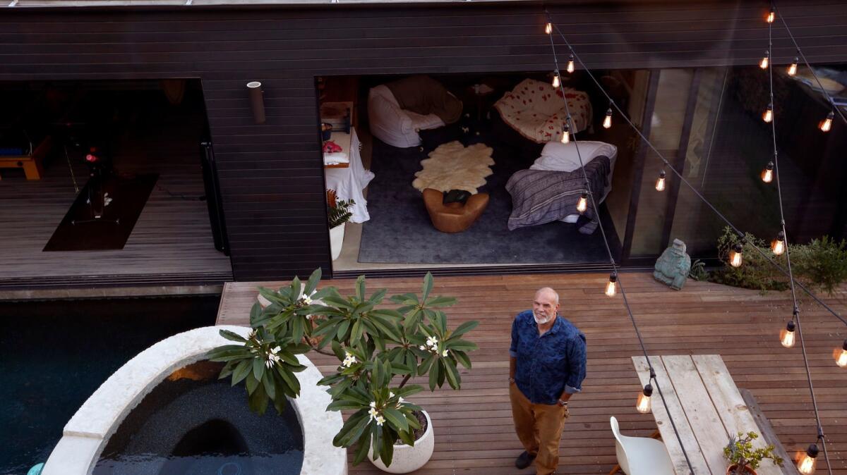 VENICE, CA - NOVEMBER 1, 2016 - Paul Hibler stands on a wooden deck which features a sauna and swimming pool at his home in Venice on November 1, 2016. (Genaro Molina / Los Angeles Times)