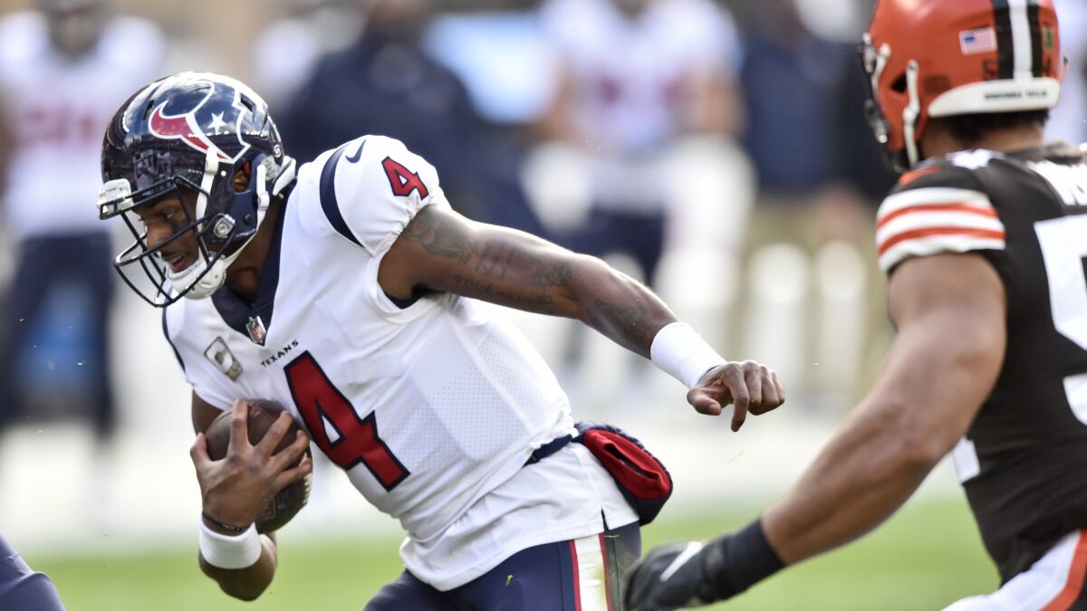 Houston Texans quarterback Deshaun Watson rushes during the first half of an NFL football game against the Cleveland Browns, Sunday, Nov. 15, 2020, in Cleveland. (AP Photo/David Richard)