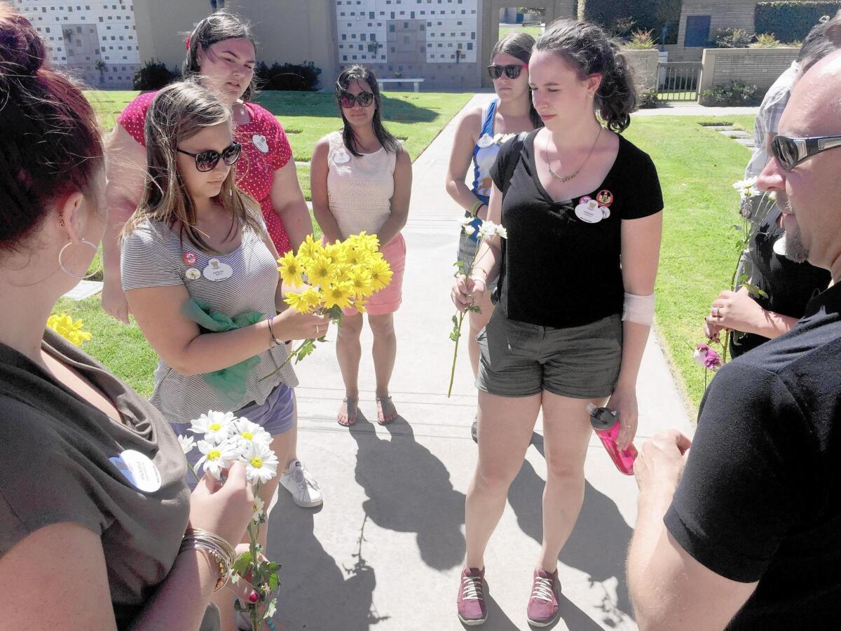 Students from Western Michigan University, on the last of a nine-day tour trip following Walt Disney's path to California, stopped at Forest Lawn Memorial Park in Glendale, where the Disney creator is buried.