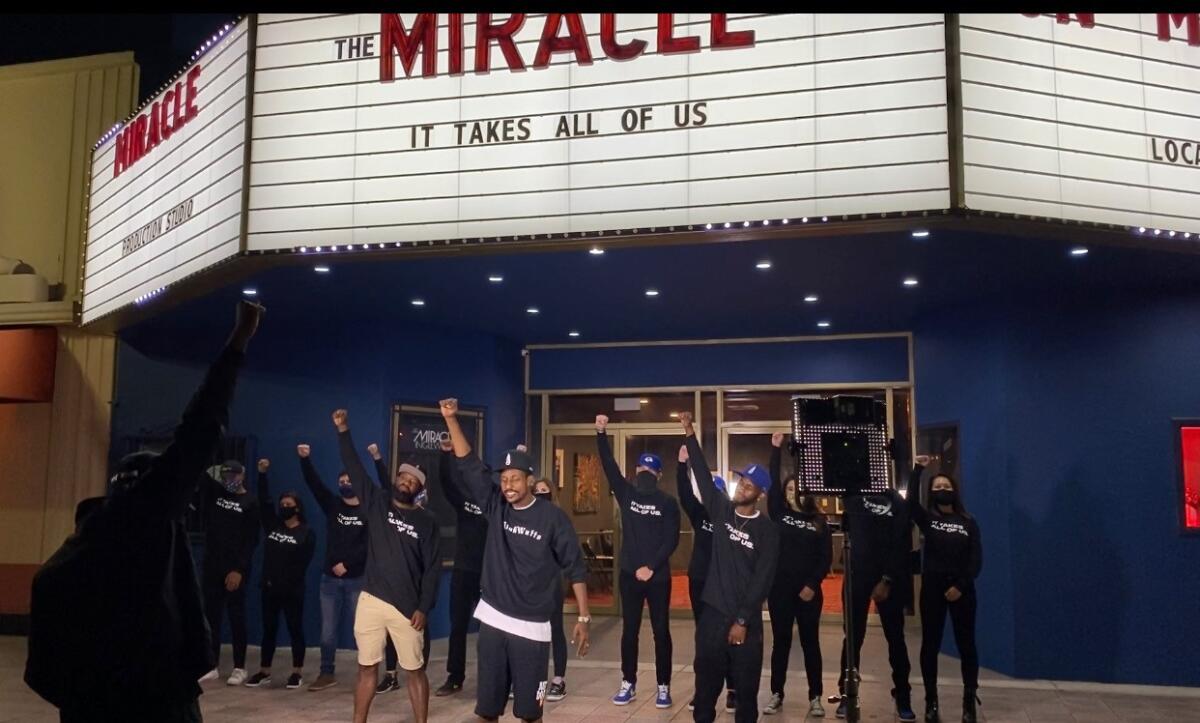 Stix, a Watts native, rapper and community activist, performs in a music video for the Rams.