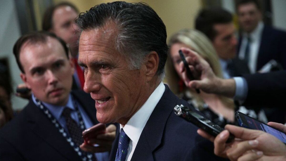 Sen. Mitt Romney (R-Utah) speaks to media in Washington in May. 
