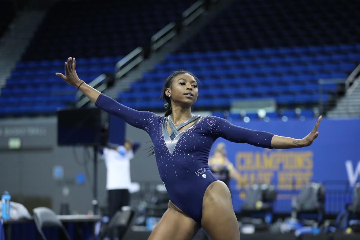 UCLA gymnast Nia Dennis takes part in a team practice session on Jan. 12.