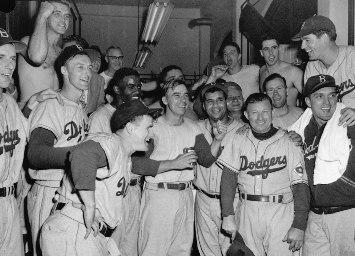 Carl Erskine, on the far right of the first row, celebrates a Brooklyn Dodgers victory in 1951.